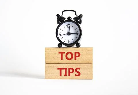 Top Tips symbol. Concept words Top Tips on wooden blocks. Beautiful white b.. Stock Photos