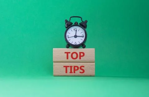 Top Tips symbol. Concept words Top Tips on wooden blocks. Beautiful green b.. Stock Photos
