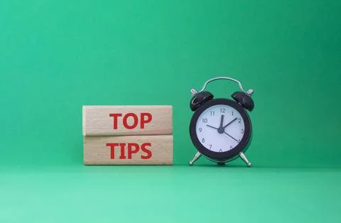 Top Tips symbol. Concept words Top Tips on wooden blocks. Beautiful green b.. Stock Photos
