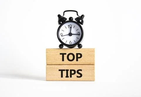 Top Tips symbol. Concept words Top Tips on wooden blocks. Beautiful white b.. Stock Photos
