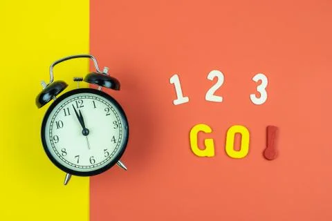 Top view of "1 2 3 Go" wording with classic clock on colorful  background Stock Photos
