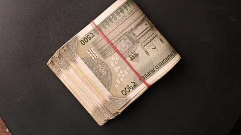 Top View of 500/- Rupee Note Bundle Rotating on Black Background Stock Footage 329339735