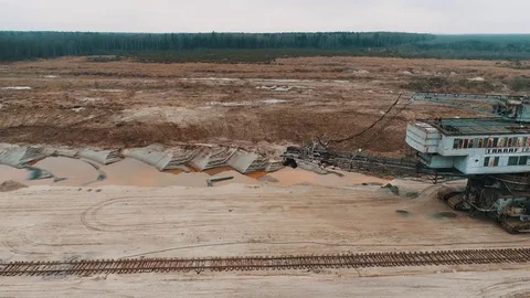 Top view of abandoned giant excavator. An abandoned giant excavator and a non Video stock 83736617