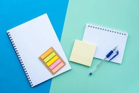 Top view, above. Flat lay with spiral notepad, notebook, sticker Stock Photos