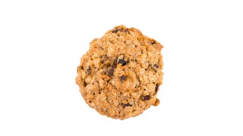 Top view from above of one oatmeal raisin cookie rotating on the turntable. Stock Footage 94899643