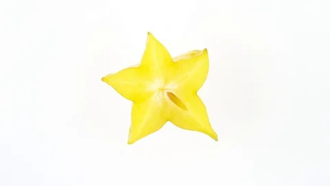 Top view from above of one star shaped slice of ripe carambola fruit.  Stock Footage 95467830