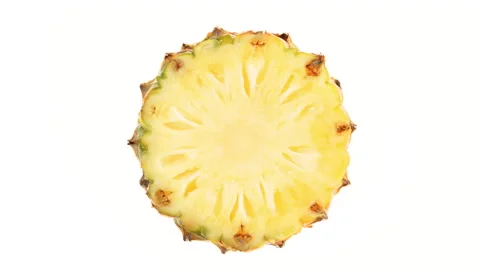 Top view from above of pineapple fruit cross cut rotating. Isolated on white Stock Footage 169763546