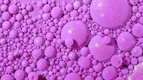 Top view abstract of pink bubbles in paint. Inks, spheres, oil. Colorful shapes Stock Photos
