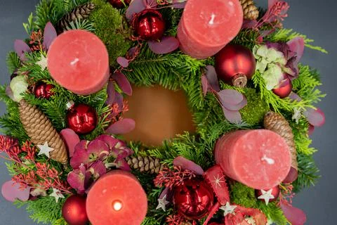 Top view of advent wreath with one red burning candle on gray background Stock Photos
