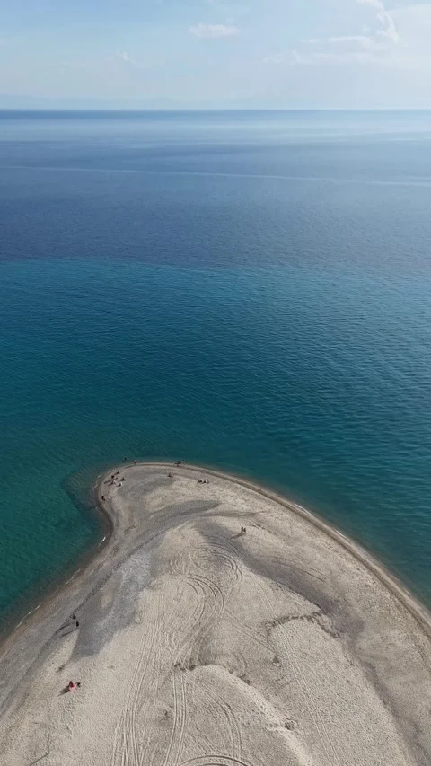 Top view aerial shot of Possidi Cape sandbar beach in Halkidiki Greece with turq Stock Footage 341461645