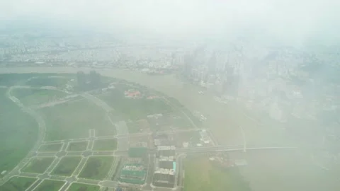 Top view aerial through the clouds of a Ho Chi Minh City, Vietnam Stock Footage 204850591