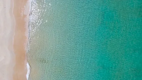 Top view Aerial view of drone Turquoise beach sea sand copy space. 4K Nature vid 스톡 동영상 153385145