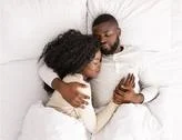 Top View Of African American Couple Sleeping Together In Bed Stock Photos