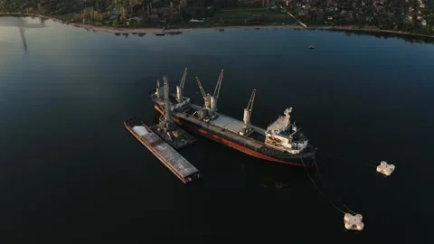 Top view from the air on the big cargo ship on the river near the shore Stock Footage 144246594