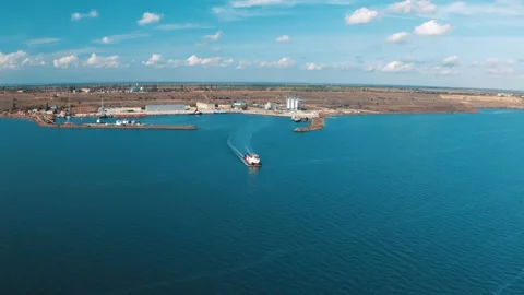 Top view from the air on the sailing cargo ship with grain from the port. View Stock Footage 144733998