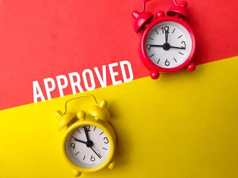 Top view alarm clock with text APPROVED Stock Photos