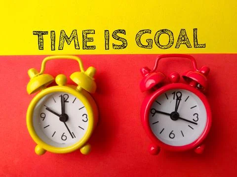 Top view alarm clock with text TIKE IS GOAL Stock Photos