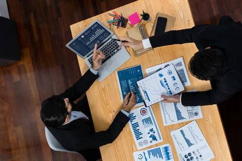 Top view analyst team working on dashboard paper on table. Fervent Stock Photos