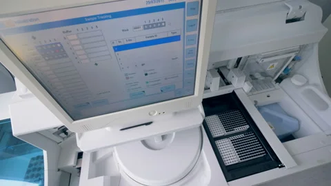 Top view of an analyzing machine processing samples Stock Footage 94658890