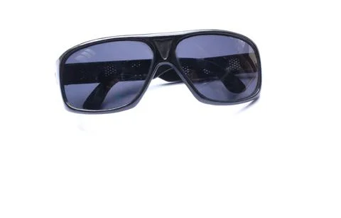 Top view and flat lay Fashion modern black sunglasses on white background. Stock Photos