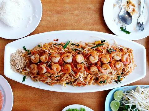 Top view and flat lay of big size dried noodle or Pad Thai with many shrimps Stock Photos