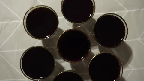 Top view and rotating of several glass glasses with wine on the table to toast Stock Footage 167372954