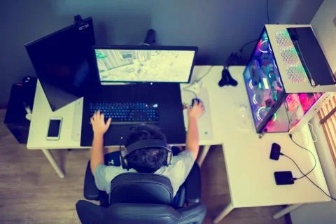 Top view and selective focus to black armchair and blurry Asian boy gamer. Фото