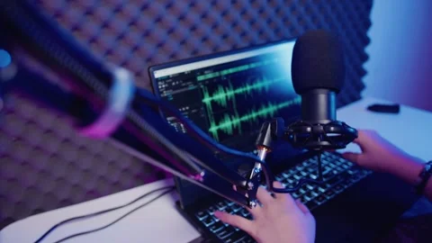 Top view and zoom in hands pressing keys on laptop keyboard to edit audio track 库存影片 309799161