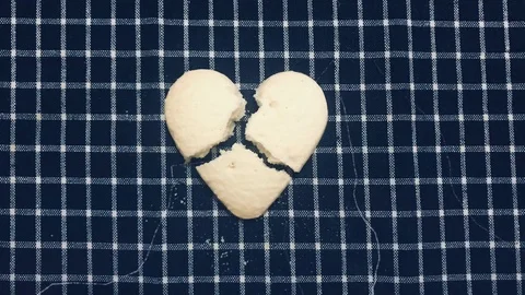 Top view animation broken heart cookie splitted by lightning Stock Footage 100793623