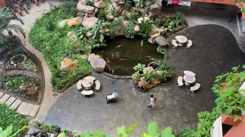 Top view apartment building. Ground floor with tree, plants and pond, Thailand Stock Footage 245727807