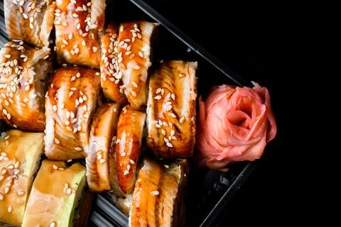 Top view of appetizing sushi rolls with eel, avocado, sesame, vegetables, salmob Stock Photos