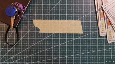 Top view of applying blank tape mockup near money and house keys Stock Footage 338183812