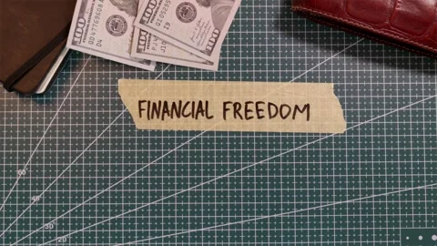 Top view of applying FINANCIAL FREEDOM handwritten tape near cash and calcu.. Stock Footage 338183851