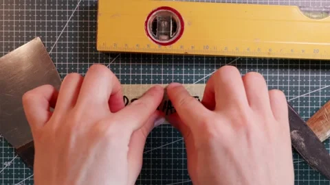 Top view of applying PRO QUALITY handwritten tape on green mat. Stock-Footage 337816287