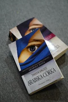 Top view of Arabska Corka novel meaning Arabian daughter in English on gray back Stock Photos