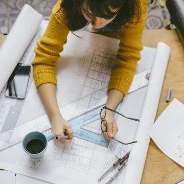 Top view of architect woman working on architectural project for interior d.. Stock-Fotos