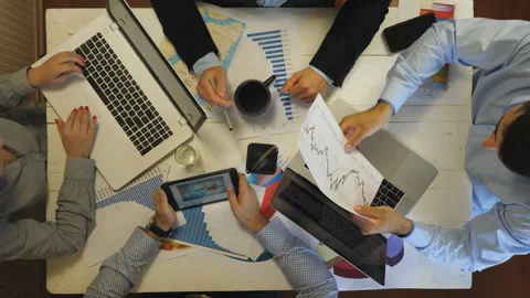 Top view to arms of managers plan future project sitting at table Stock Footage 321306481