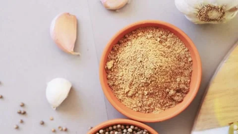 Top view of aromatic dry spices and garlic cloves on a table Stock-Footage 334572558