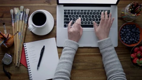 Top View Of Artist Browsing The Internet For New Art Supplies For Her Art Studio Stock Footage 82374310