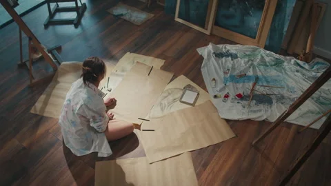 Top View. Artist Uses Drawing as Therapy to Restore Inner Peace in Bright Studio Stock Footage 307338165