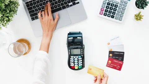 Top view of Asia lady using laptop online shopping with credit card pay the.. Stock Photos
