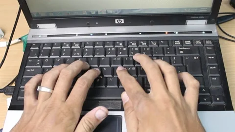 Top View of a Asian Man Typing on a Laptop Keyboard 動画素材 161140389