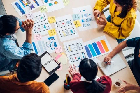 Top view asian ux developer and ui designer brainstorming about mobile app in Stock Photos