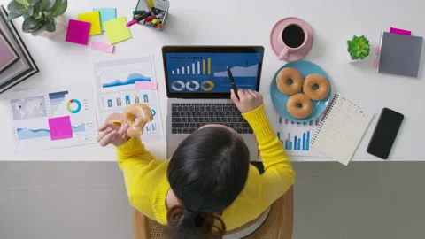 Top view asian work study at home eat donut junk food stress relief. Stock Footage 158660120