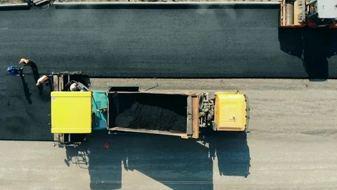 Top view of an asphalt road being made. Asphalt paver machine on a road Stock Footage 119765699