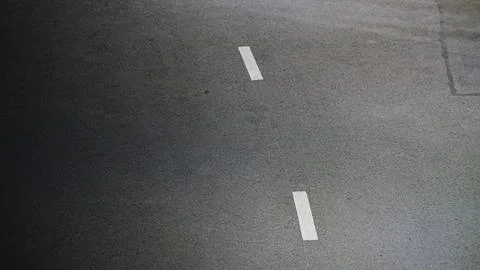 Top view of asphalt road with dashed white dividing line 库存照片