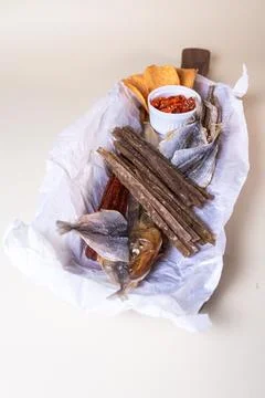 Top view of assorted dry fish for beer. fish on a wooden board Stock Photos