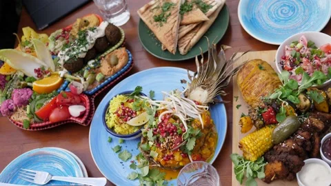 Top view of assorted healthy vegan options from global cuisines. Middle eastern Stock Footage 139883930