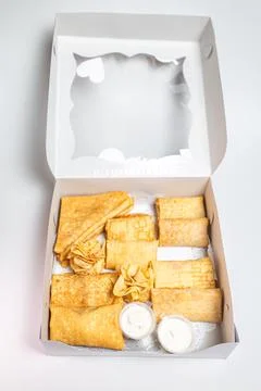 Top view assorted pancakes with various fillings in a white package. Carniv.. Foto stock
