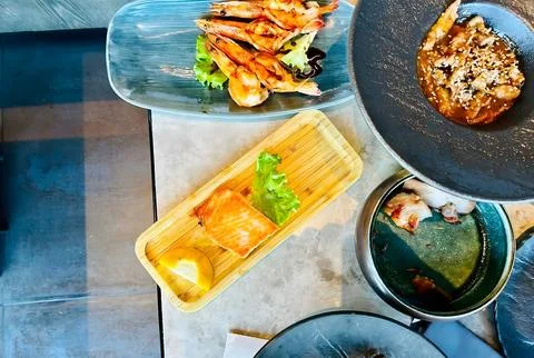 Top View of Assorted Seafood Appetizers with Grilled Salmon and Shrimp Stock-Fotos